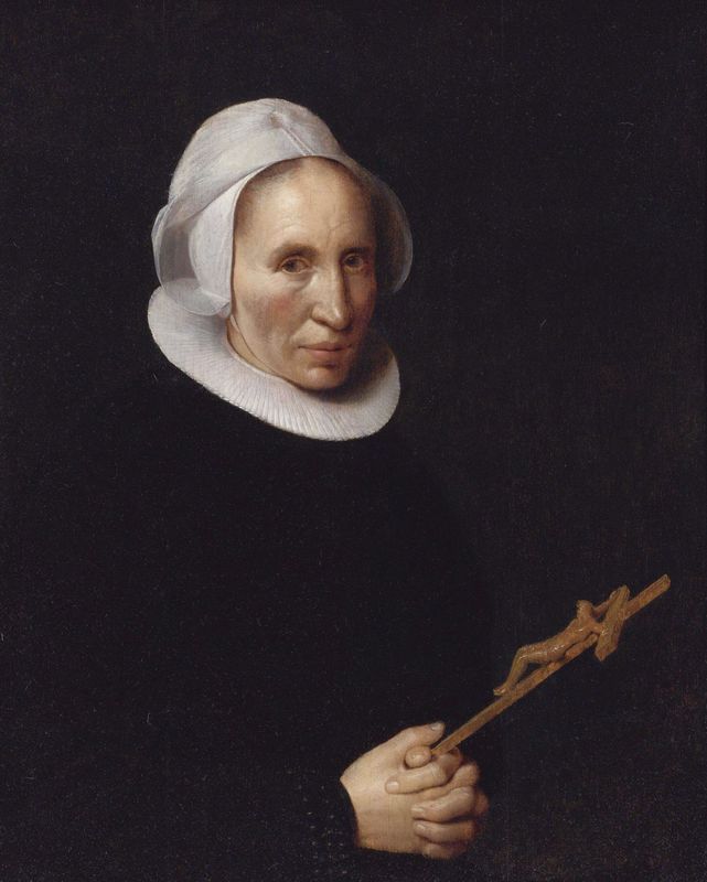A lady holding a crucifix