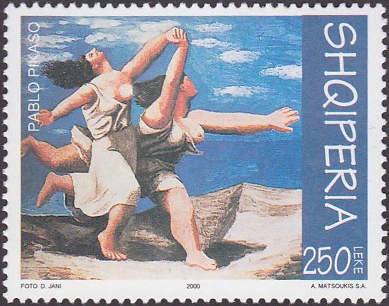 Two women running on the beach