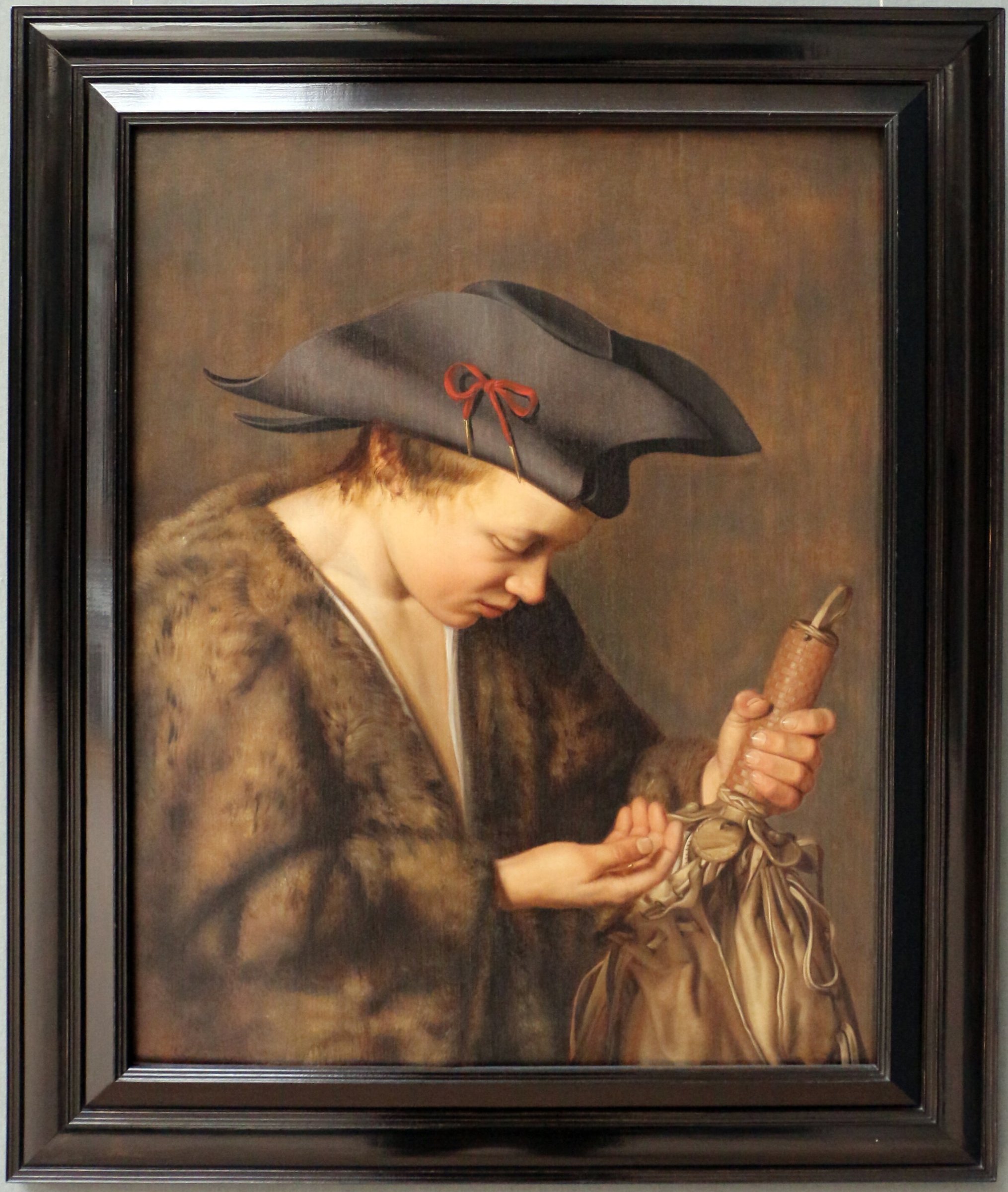 A boy counting coins by Willem van der Vliet