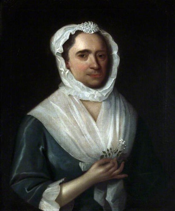 Portrait of a Woman Wearing a Blue Silk Dress Holding a Jasmine Flower