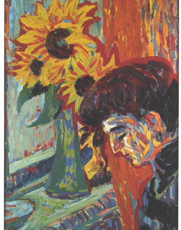 Frauenkopf vor Sonnenblumen